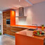 Teakholz Küche mit orange komposit Arbeitsplatte Ekelhoff Küchen