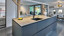 Mattschwarzes Kücheninsel mit Dekton Arbeitsplatte - realisiert von Ekelhoff Küchen in Nordhorn.