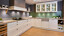 Landhaus U-Küche in weiße und salbeigrüne satinlack - Ekelhoff Küchen