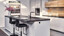 Keuken-Aanbieding: contur keuken in hoogglans wit en licht eiken. Met kookeiland en bar.