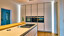 Hoge keukenkast van next125 keukens met kookeiland van Ekelhoff Keukens